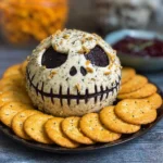 Skellington Cheese Ball Appetizer with olives and crackers