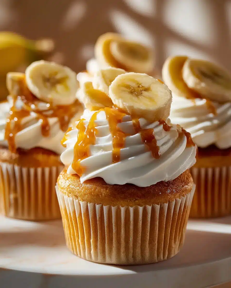Delicious banana pudding cupcakes topped with creamy frosting and banana slices