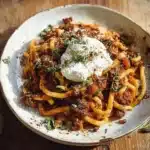 Plate of Pumpkin Beef Bolognese garnished with herbs