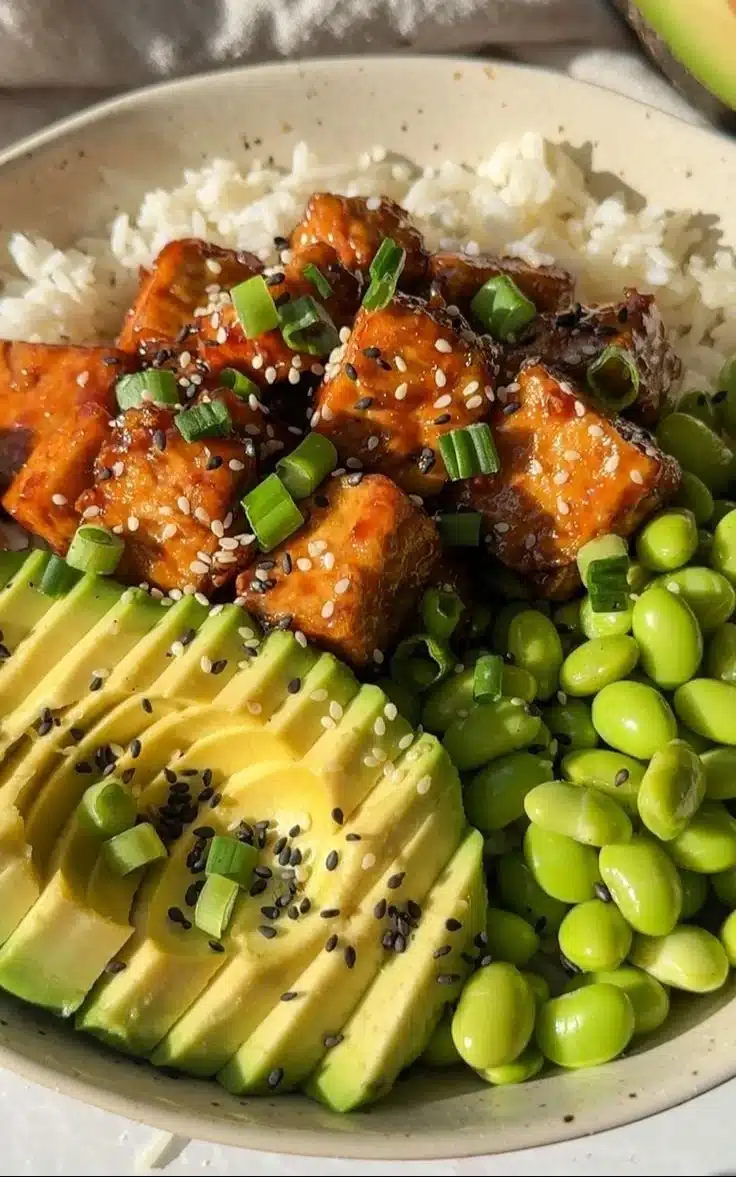 Delicious sticky tofu bowl with vegetables and sauce