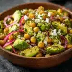 Bowl of vibrant Chickpea Feta Avocado Salad with fresh vegetables