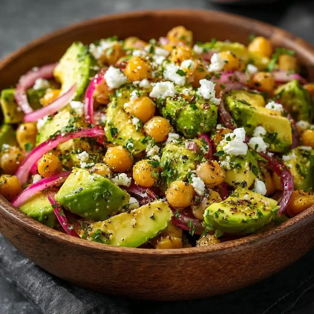 Bowl of vibrant Chickpea Feta Avocado Salad with fresh vegetables