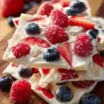 Delicious frozen yogurt bark topped with fruits and nuts