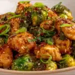 Air fryer sweet chili chicken served on a plate with vegetables