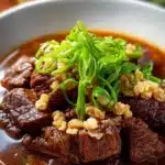 Delicious beef pares, a traditional Filipino dish with tender beef in rich broth.