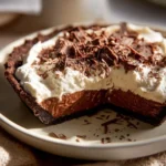 Delicious Irish Coffee Pie topped with whipped cream and coffee beans.
