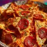 A bowl of crispy Pizza Chips served with dipping sauce for a tasty snack experience.