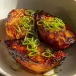 Delicious Chili Miso Butter Cabbage dish garnished with fresh herbs.
