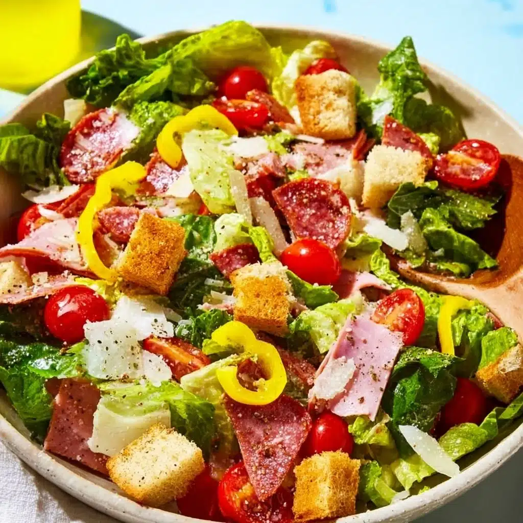 A colorful bowl of Italian Grinder Salad with fresh vegetables and toppings