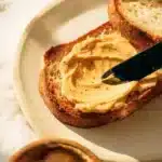 Delicious miso butter spread on fresh bread, showcasing its creamy texture and rich color.