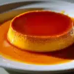 Delicious Puerto Rican creamy cheesecake served with fruit topping