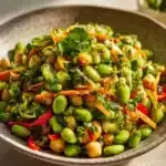Chickpea Edamame Salad with Ginger Sesame Vinaigrette in a colorful bowl