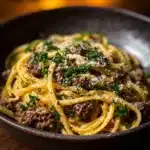 Delicious creamy Parmesan beef linguine in garlic butter sauce served in a bowl.