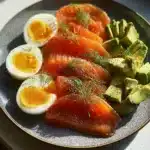 Smoked salmon avocado protein plate with fresh ingredients