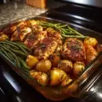 Delicious Garlic Herb Chicken served with roasted potatoes and green beans.