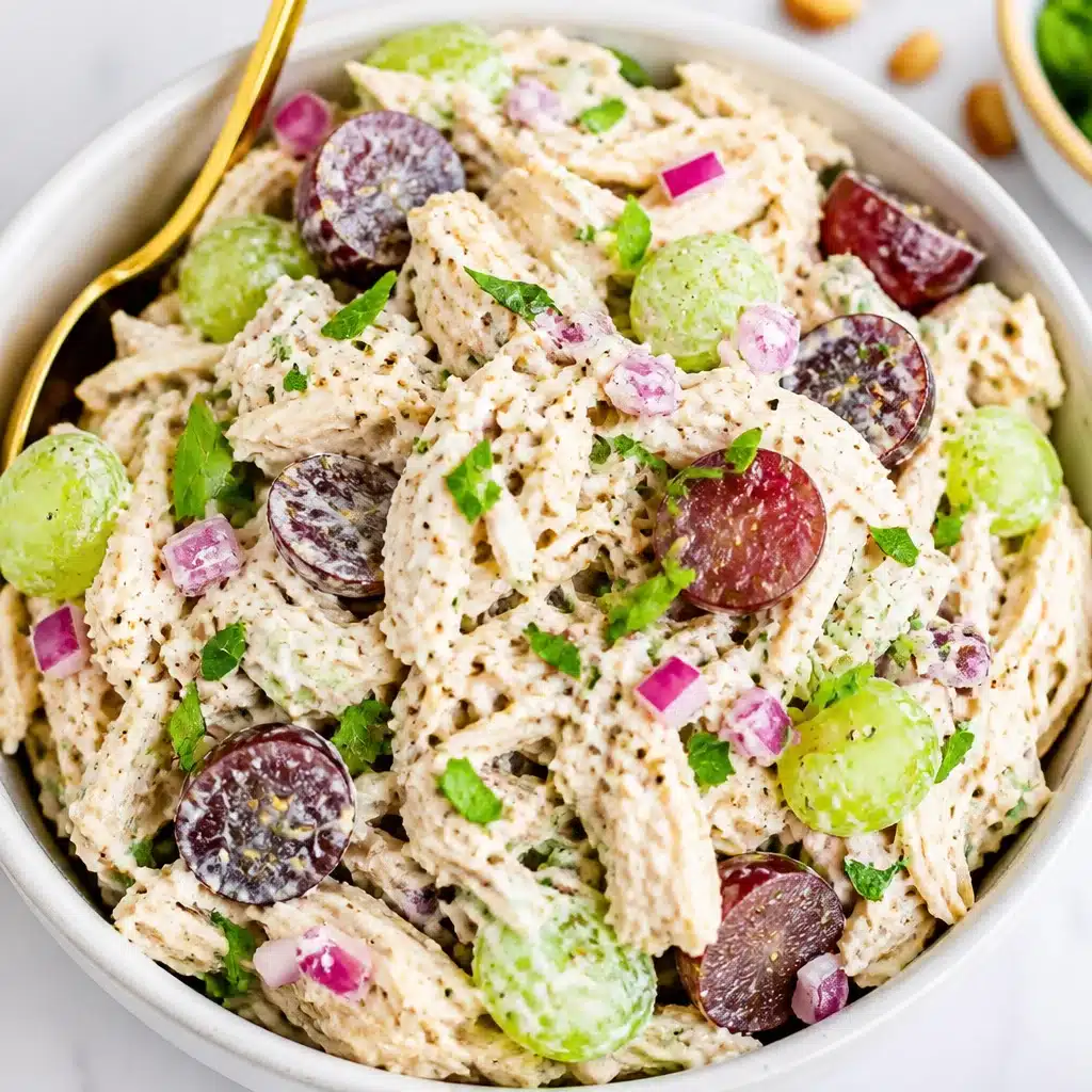 High-protein Greek yogurt chicken salad with fresh ingredients and herbs.