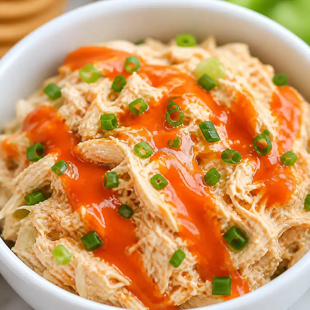 High-Protein Buffalo Chicken Salad Bowl with shredded chicken, greens, and ranch dressing.