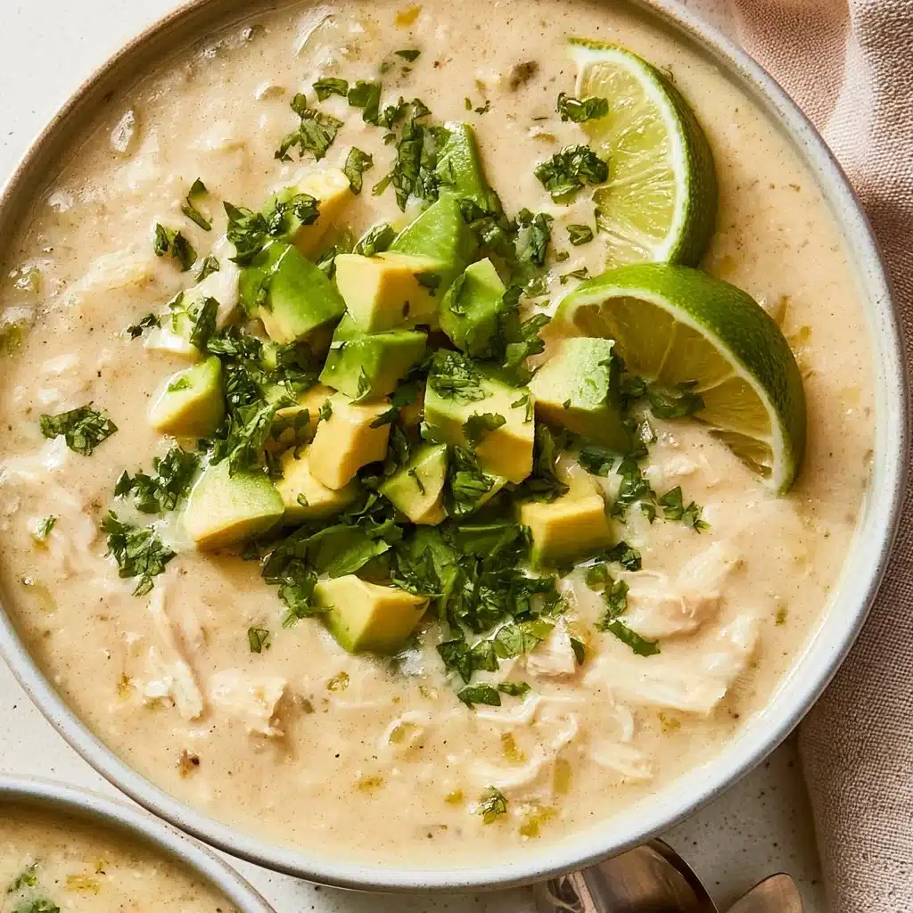 Bowl of Whole30 White Chicken Chili with fresh toppings