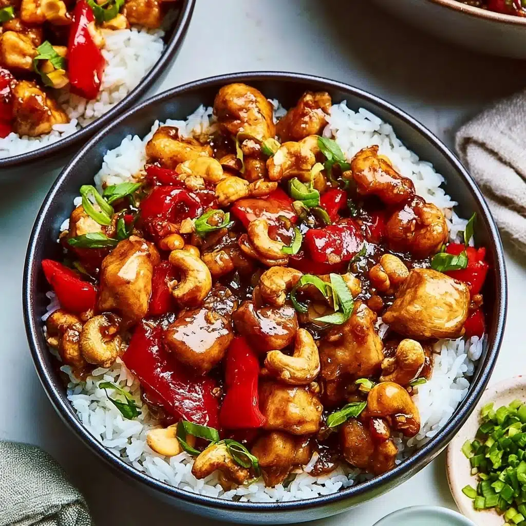 Plate of cashew chicken with vegetables and cashews, garnished for a tasty meal.