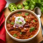 Bowl of Macro-Friendly Slow Cooker Turkey Chili topped with cheese and avocado