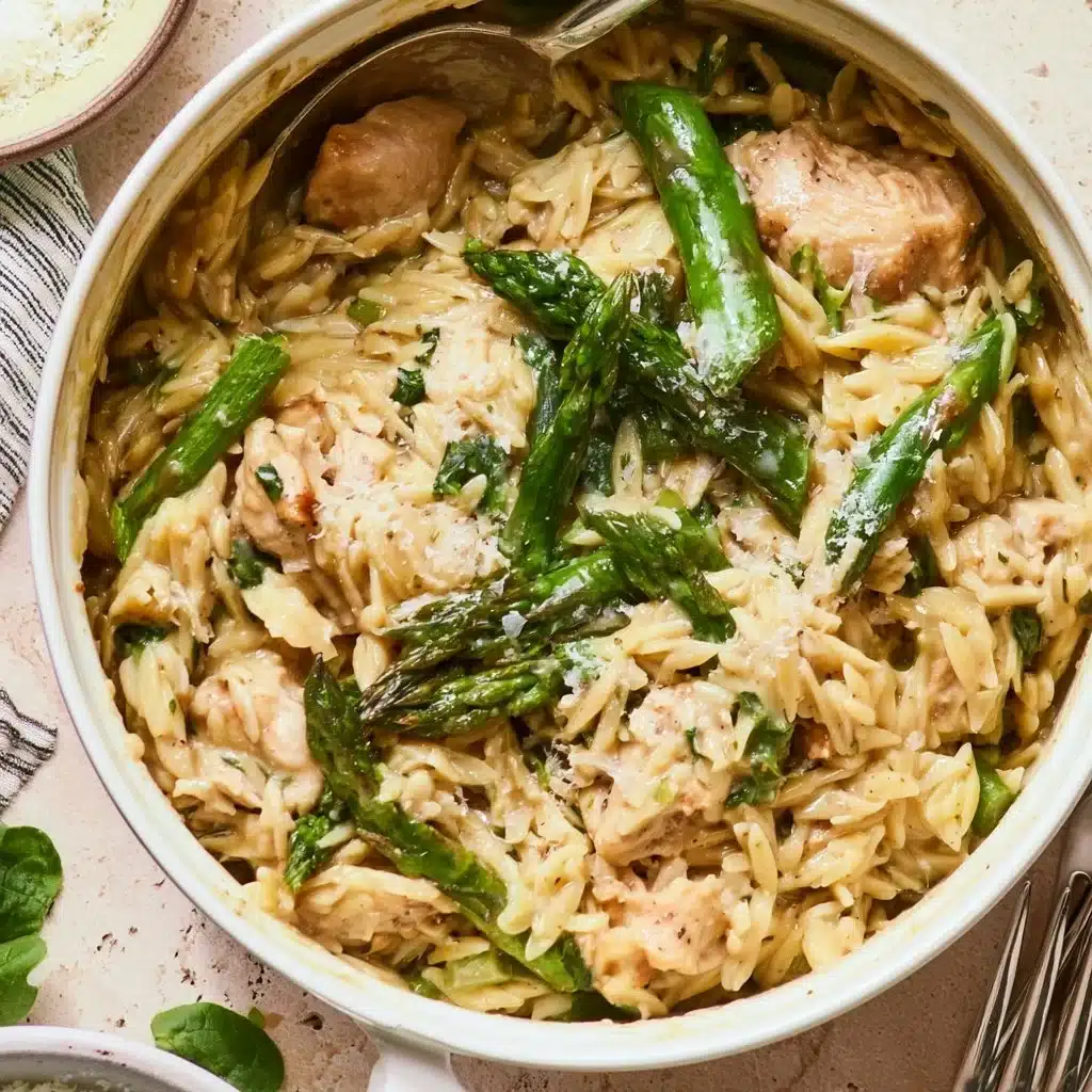 High protein chicken orzo dish served in a bowl, garnished with herbs