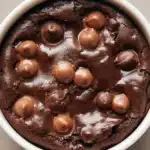 Delicious chocolate brownie oatmeal baked in a dish, perfect for breakfast.
